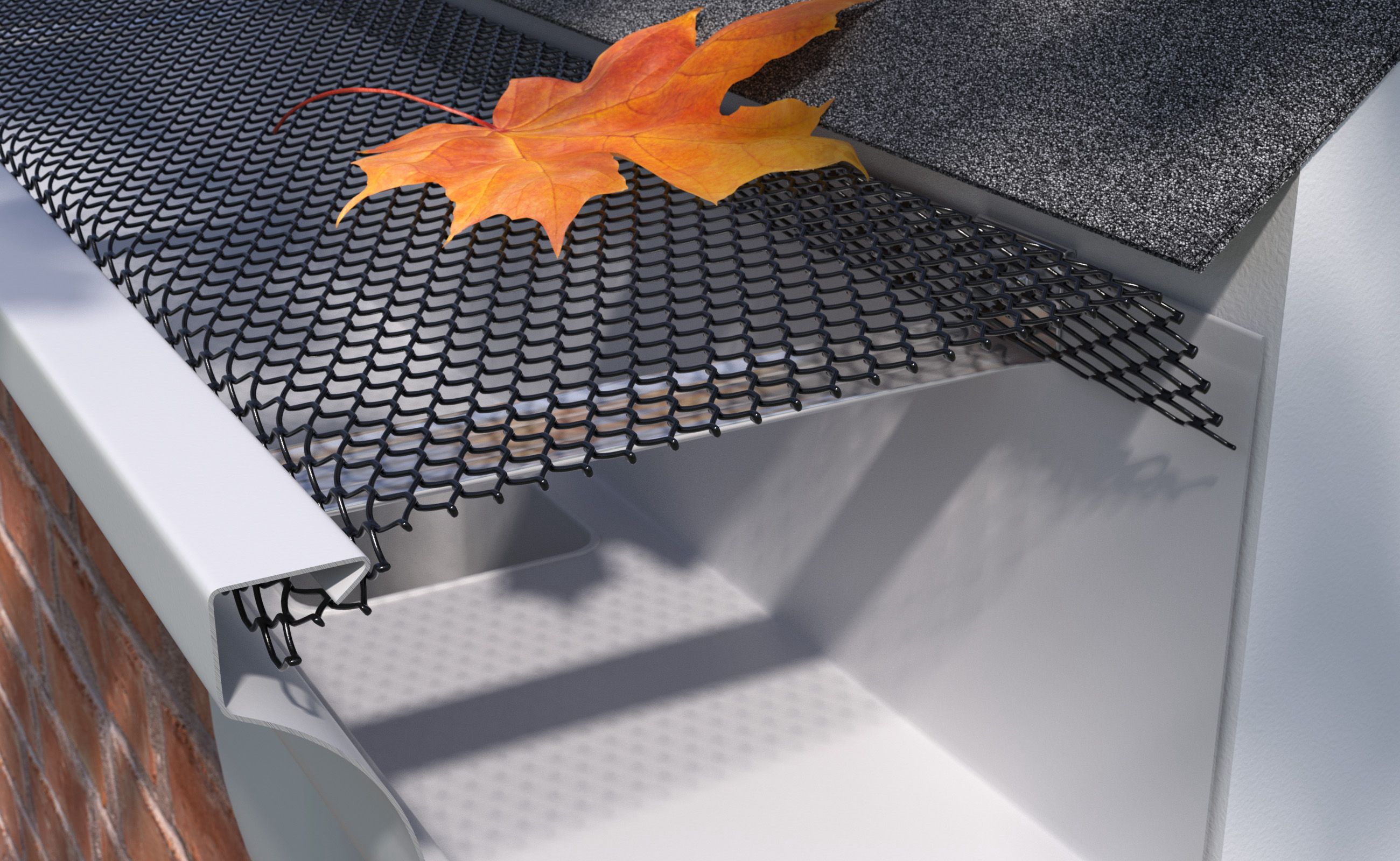 Leaves and debris collected on top of a gutter guard along a roofline