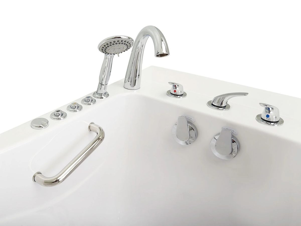 Chrome faucet, handheld shower head and control valves on the rim of a walk-in tub