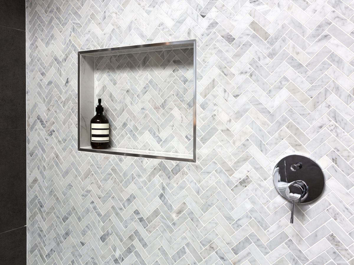 Recessed tile niche in a walk-in shower wall