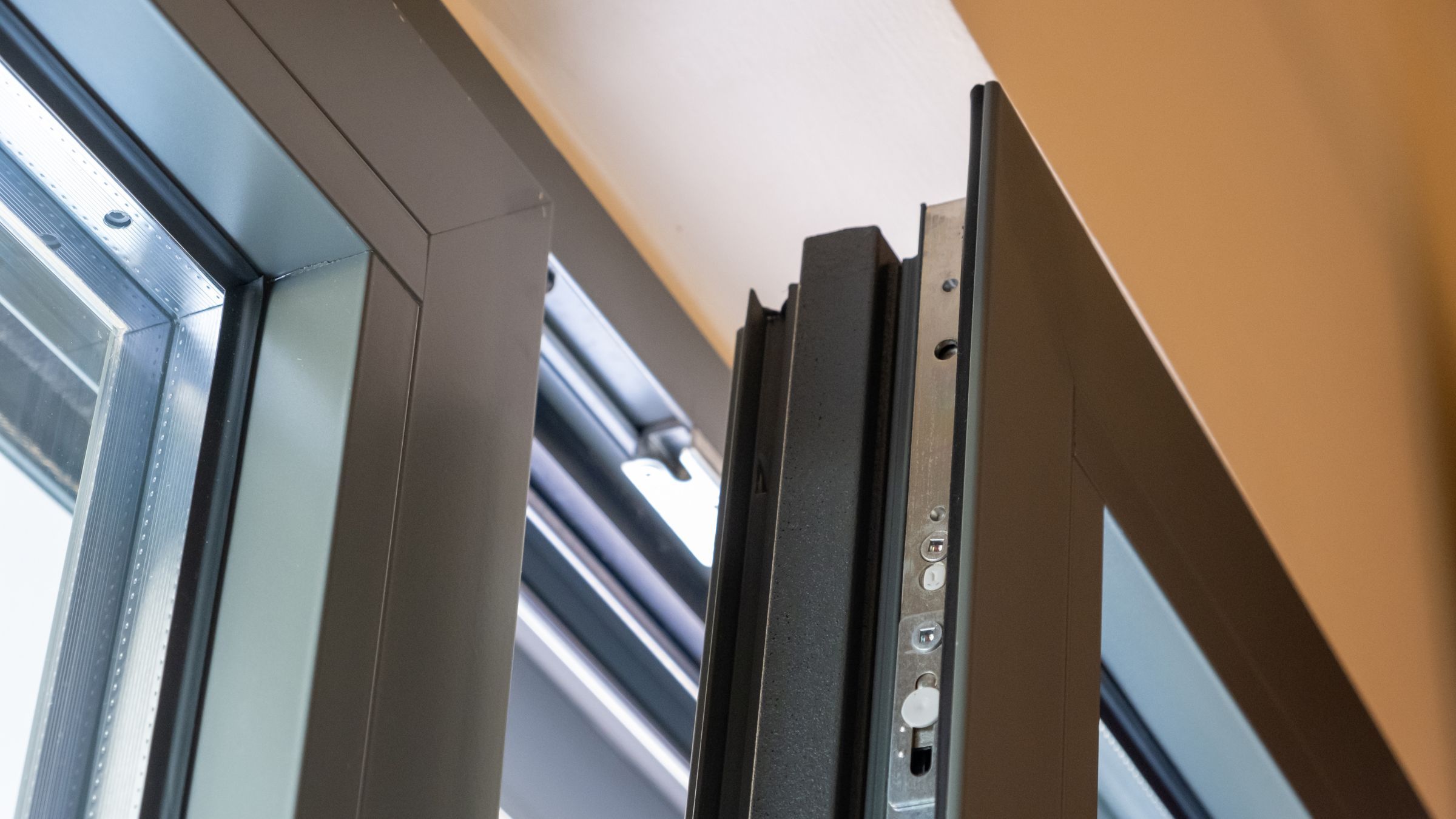 Close-up of a window frame corner showing the sash and frame profile